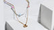 Charming Charlie 2-Layered Beaded Flower and Barebada Bead Chain with Heart Pendant Necklace - Women's Layered Necklaces for a Stylish Look with a Touch of Love.